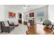 Bright home office featuring a ceiling fan, large windows, and a comfortable sitting area at 17740 Bright Wheat Dr, Lithia, FL 33547