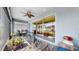 The covered patio offers a spot for relaxation, complete with comfortable seating and stylish décor at 17740 Bright Wheat Dr, Lithia, FL 33547
