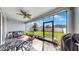 Relax on the patio with views of the fenced backyard, featuring a seating area and outdoor grill at 17740 Bright Wheat Dr, Lithia, FL 33547