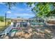 Backyard includes an above-ground pool with a deck and a screened patio enclosure at 1968 Rolling Green Cir, Sarasota, FL 34240