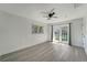 Bedroom featuring stylish new flooring, ceiling fan, and French doors leading to outdoor space at 1968 Rolling Green Cir, Sarasota, FL 34240