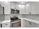 Well-equipped kitchen with modern appliances, stylish cabinets, and elegant countertops at 1968 Rolling Green Cir, Sarasota, FL 34240
