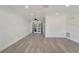 Bright living room with recessed lighting, crown molding, and French doors at 1968 Rolling Green Cir, Sarasota, FL 34240
