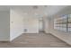 Bright living room featuring new vinyl plank flooring, recessed lighting and a large window at 1968 Rolling Green Cir, Sarasota, FL 34240