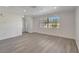 Bright living room featuring new vinyl plank flooring, recessed lighting and a front door at 1968 Rolling Green Cir, Sarasota, FL 34240