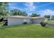 Single-story home with a well-maintained lawn at 1968 Rolling Green Cir, Sarasota, FL 34240