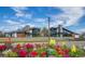 Community clubhouse featuring modern architecture with colorful landscaping at 2106 Alimara Ct, Odessa, FL 33556