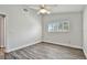 Comfortable bedroom featuring hardwood floors, neutral walls, and plantation shutters that add natural light at 2291 Americus W Blvd # 41, Clearwater, FL 33763