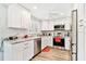 Well-lit kitchen featuring granite countertops and stainless steel appliances at 2291 Americus W Blvd # 41, Clearwater, FL 33763