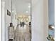 Inviting condo interior with a hardwood hallway leading to the dining and living room with recessed lighting at 2291 Americus W Blvd # 41, Clearwater, FL 33763