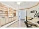 Spacious home office with built-in shelving, hardwood floors, and recessed lighting for a comfortable workspace at 2291 Americus W Blvd # 41, Clearwater, FL 33763