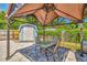 Backyard features gazebo with lighting and outdoor seating, plus a small barn at 3045 Stratford Dr, Largo, FL 33771