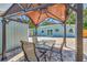 Outdoor patio area with a gazebo, seating for four, and brick pavers at 3045 Stratford Dr, Largo, FL 33771
