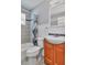 Bathroom with shower over tub, modern fixtures, and wood-look cabinets at 3045 Stratford Dr, Largo, FL 33771