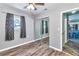 Bedroom with wood-look floors and a closet is located next to kitchen at 3045 Stratford Dr, Largo, FL 33771