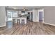 Modern kitchen with stainless steel appliances, granite countertops, an island with seating, and tile floors at 3045 Stratford Dr, Largo, FL 33771