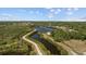 Scenic aerial view of neighborhood showcasing waterways, pathways, and lush greenery at 3204 40Th S Way # B, St Petersburg, FL 33711