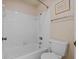 Cozy bathroom with a shower-tub combo and tiled walls at 3204 40Th S Way # B, St Petersburg, FL 33711