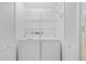 Convenient laundry area equipped with a washer, dryer, and shelving for storage at 3204 40Th S Way # B, St Petersburg, FL 33711