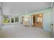 Enclosed patio with tile flooring and sliding doors, offering a bright living space at 3204 40Th S Way # B, St Petersburg, FL 33711