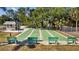 Community shuffleboard courts with seating and shade, perfect for recreation at 3204 40Th S Way # B, St Petersburg, FL 33711