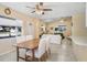 Spacious living room with a wood table and white chairs at 3214 W Rogers Ave, Tampa, FL 33611