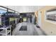 Enclosed sunroom featuring wood-look tile floors and lots of natural light at 3214 W Rogers Ave, Tampa, FL 33611