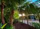 Scenic backyard view with lush greenery, and mature trees and a fence at 3240 Sand Key Dr, Palm Harbor, FL 34684