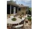 Outdoor patio with comfortable seating and a dining area for entertaining at 3240 Sand Key Dr, Palm Harbor, FL 34684