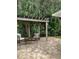 Outdoor patio space with brick pavers, pergola, and seating area at 3240 Sand Key Dr, Palm Harbor, FL 34684