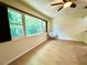 Bright bedroom with large window provides plenty of natural light and relaxing outdoor view at 3240 Sand Key Dr, Palm Harbor, FL 34684