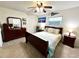 Spacious bedroom with ceiling fan, a large window and ample natural light at 3240 Sand Key Dr, Palm Harbor, FL 34684