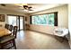 Bright dining area with sliding door access and large windows offers scenic outdoor views at 3240 Sand Key Dr, Palm Harbor, FL 34684
