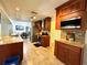 Open kitchen featuring granite countertops, custom cabinetry, and stainless steel appliances at 3240 Sand Key Dr, Palm Harbor, FL 34684