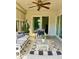 Inviting sunroom with stylish furniture, area rug, and view to the backyard at 3240 Sand Key Dr, Palm Harbor, FL 34684
