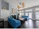 Relax in the community clubhouse with comfortable seating, fireplace, and ceiling fans at 3305 Haviland Ct # 301, Palm Harbor, FL 34684