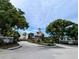 Landscaped entrance to the community creating an inviting arrival experience for residents at 3305 Haviland Ct # 301, Palm Harbor, FL 34684