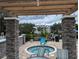 Stone hot tub with seating area overlooking a tranquil pond and community at 3305 Haviland Ct # 301, Palm Harbor, FL 34684