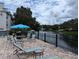 Serene view of the community pond with lounge chairs and a fountain at 3305 Haviland Ct # 301, Palm Harbor, FL 34684