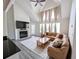 Comfortable living room featuring a fireplace, vaulted ceilings and a leather sofa at 3305 Haviland Ct # 301, Palm Harbor, FL 34684
