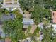 A high-angle view of a classic house surrounded by many trees and other houses nearby at 4315 W Azeele St, Tampa, FL 33609