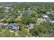 Expansive aerial view of a neighborhood featuring mature trees and various home styles at 4315 W Azeele St, Tampa, FL 33609