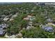A birds-eye view of a lush green landscape, with scattered homes in a classic neighborhood at 4315 W Azeele St, Tampa, FL 33609