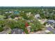 Aerial shot of a home within a leafy residential neighborhood near the water and city skyline at 5001 W Dickens Ave, Tampa, FL 33629