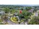 Bird's eye view showcasing a home in a leafy neighborhood with mature trees and winding roads at 5001 W Dickens Ave, Tampa, FL 33629