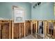 Bathroom featuring new window, blue walls, and under-floor plumbing at 5001 W Dickens Ave, Tampa, FL 33629