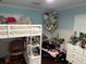 bedroom with a bunk bed, fun decor, and ample storage at 5001 W Dickens Ave, Tampa, FL 33629