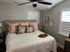 Bright bedroom featuring a ceiling fan and plentiful natural light from the window at 5001 W Dickens Ave, Tampa, FL 33629