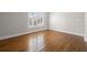 Bedroom featuring natural light from the window with plantation shutters and hardwood floors at 5001 W Dickens Ave, Tampa, FL 33629