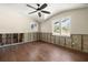 Bright bedroom featuring wood flooring and two windows at 5001 W Dickens Ave, Tampa, FL 33629